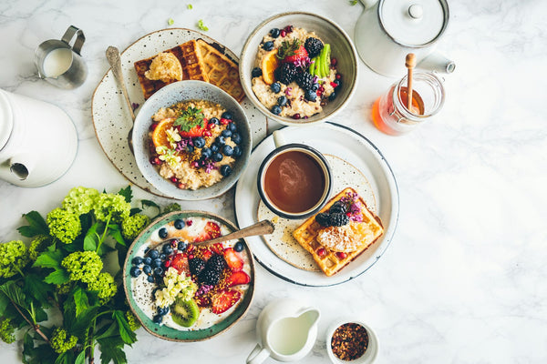Fresh fruit and a healthy breakfast bowl in soft morning light
