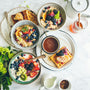 Fresh fruit and a healthy breakfast bowl in soft morning light