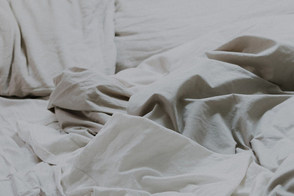 A cosy, inviting bed with soft pillows ready for a calm evening