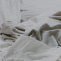 A cosy, inviting bed with soft pillows ready for a calm evening