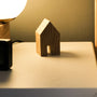 Alarm clock on a nightstand beside a bed at night