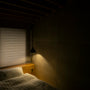 White bed linen with soft natural window light - peaceful bedroom