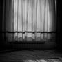 Soft morning sunlight streaming through sheer curtains onto a calmly made white-linen bed — a peaceful, considered context for thinking about mouth taping and sleep apnoea.