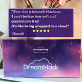 DreamMask packaging with a five-star review quote on a blurred background