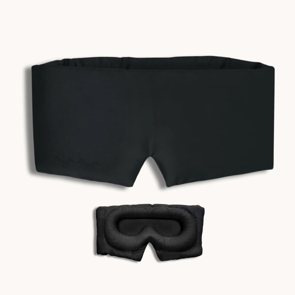 Black sleep mask and goggles on a white background