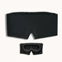Black sleep mask and goggles on a white background