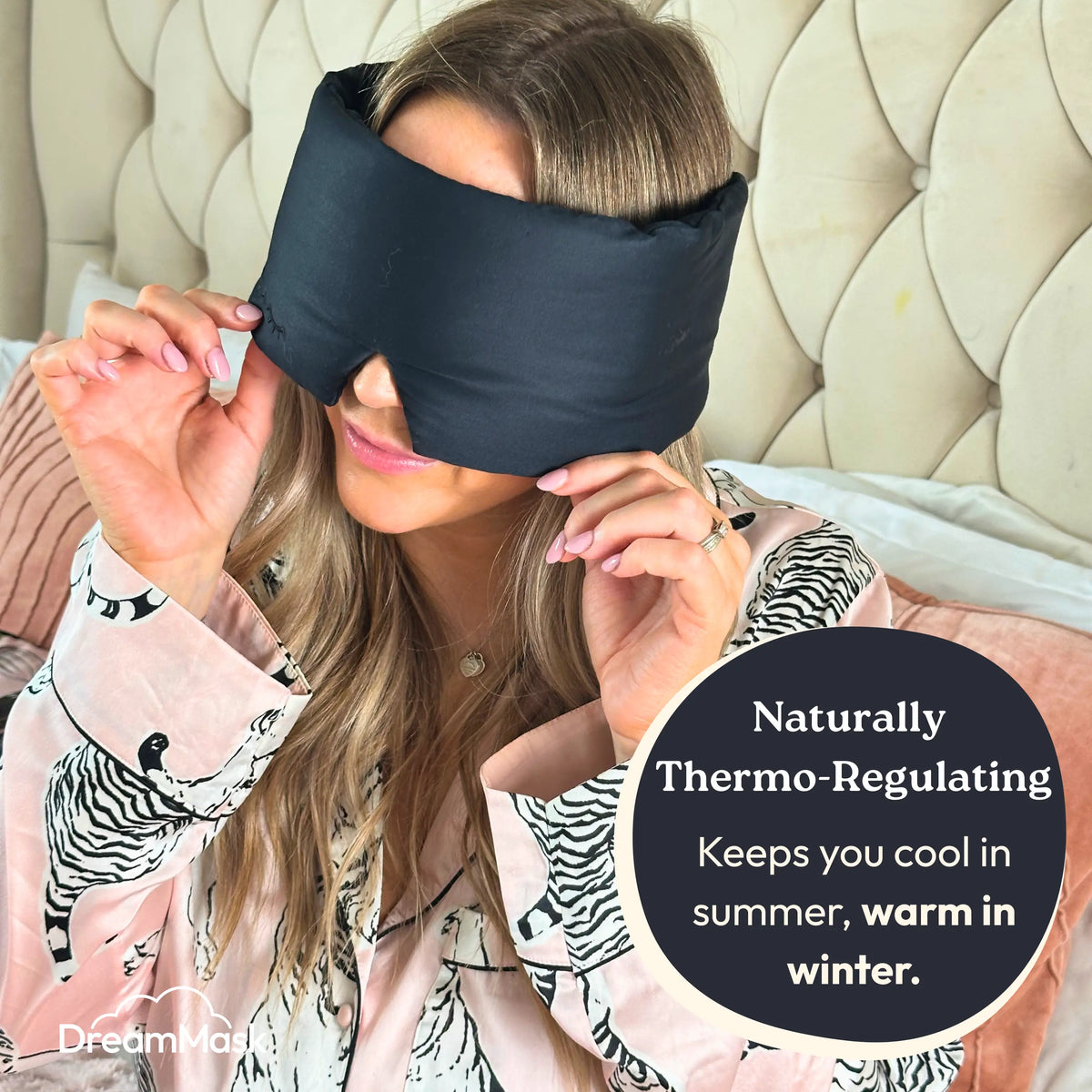 Woman wearing a black sleep mask with text about thermoregulation.