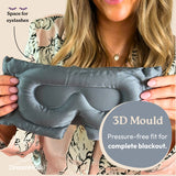 Person holding a gray sleep mask with '3D Mould' feature and DreamMask branding.