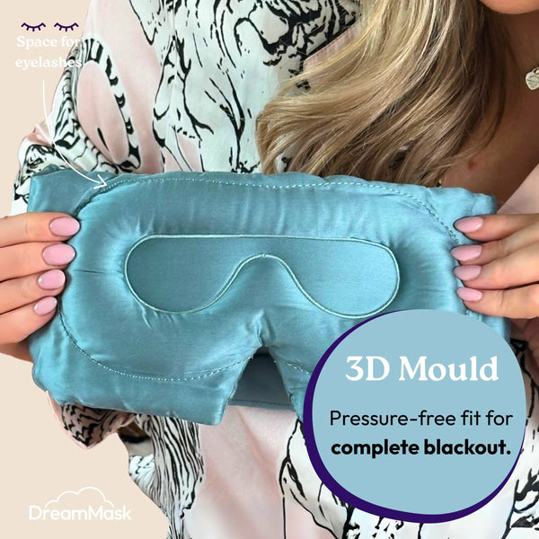 Teal sleep mask held by a person with '3D Mould' feature highlighted, brand 'DreamMask' visible.