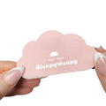 Pink cloud-shaped product with 'Sleepy Deepy' branding held by a hand on a white background